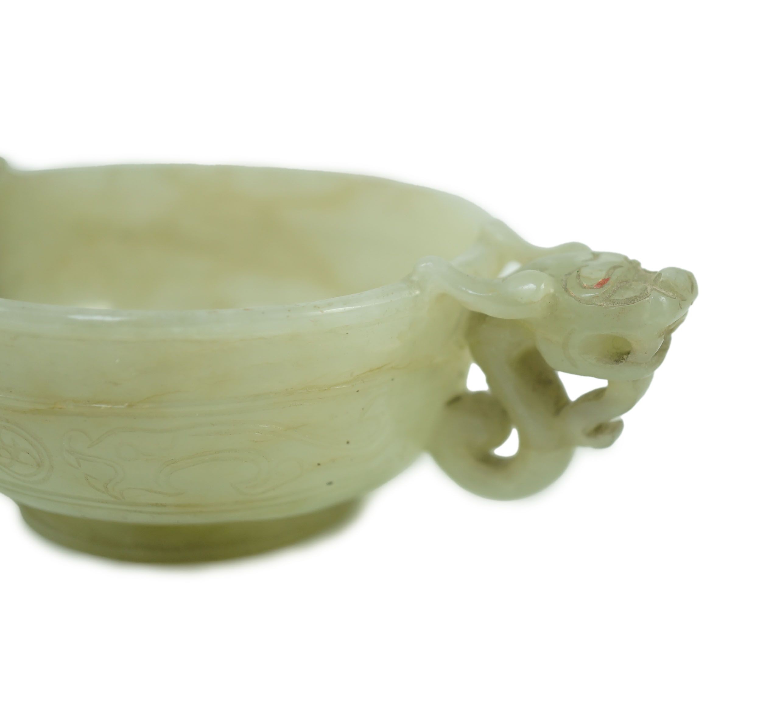 A Chinese pale celadon jade two handled ‘chilong’ cup, 17th/18th century, 13.2cm wide